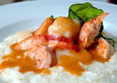 Magnolias Restaurant signature dishes Magnolias Cheeseburger
Shrimp & Sausage Over Grits
BBQ Smoked Pork Chop